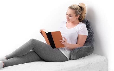This is a back pillow with arms for added comfort. 6 Best Sitting Pillows - Self Thrive