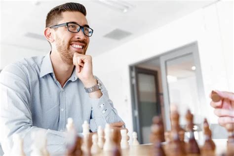 Young Man Playing Chess Stock Photo By ©sergeynivens 123639482