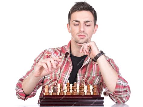 Premium Photo Young Man Playing Chess Isolated