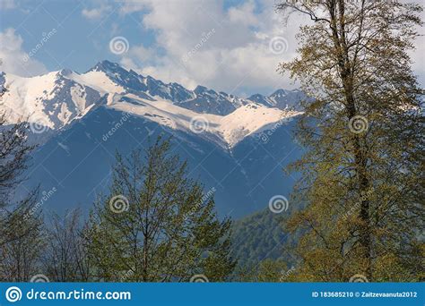 Snow Capped Mountains And Clouds Spring Landscape With Mountains And