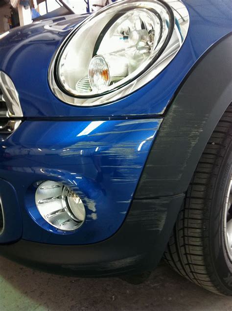 Badly scratched car bumper - Paintmedic