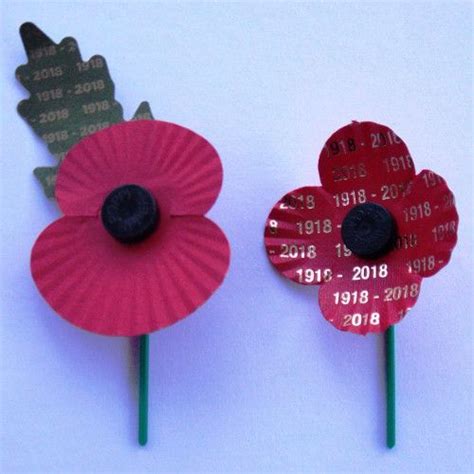 Two ‘special Edition Centenary Remembrance Poppies Left English