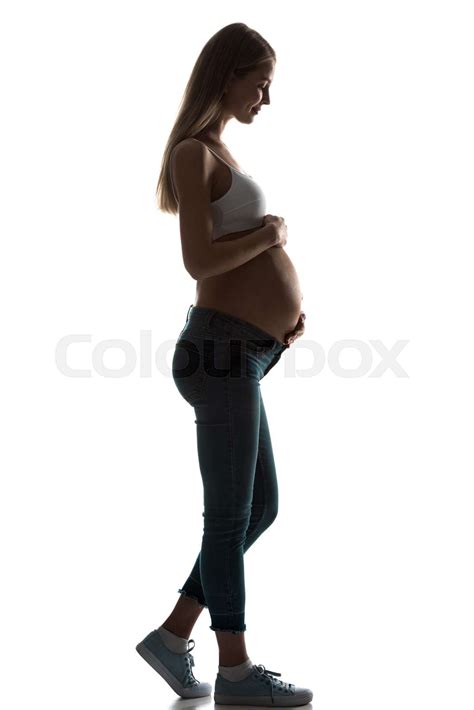 Silhouette Of Pregnant Woman Touching Her Belly Isolated On White