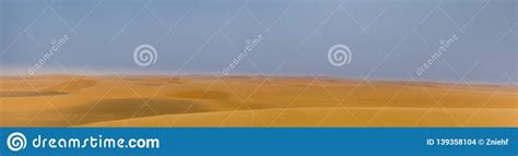 Intentionally Blurred Panorama Of A Desert Landscape With Sand Dunes