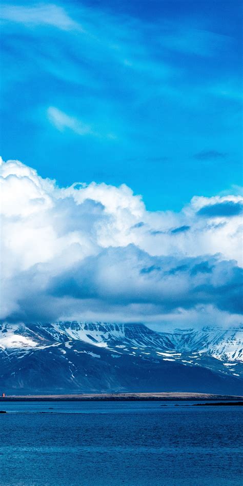 Download 1080x2160 Wallpaper Blue Sky Clouds Mountains Winter Sea