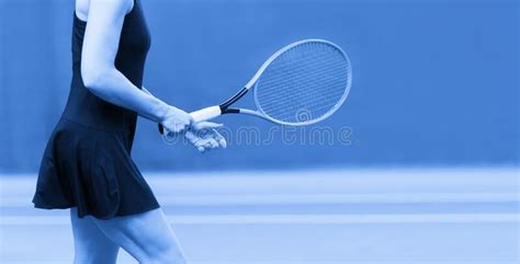 Close Up Of Woman Is Holding Tennis Racket On Hard Tennis Court Blue