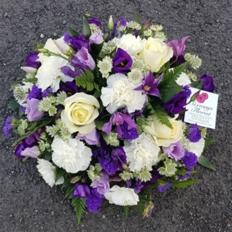 Usual practice is a smaller bouquet or even a plant. Purple/white funeral posy | Six Ways Florist
