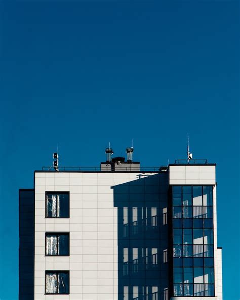 White Concrete Building Under Blue Sky · Free Stock Photo