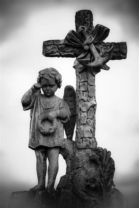 Weeping Boy Against A Cross Cemetery Statues Cemeteries Photography