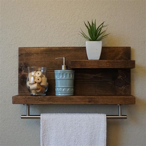 This modern bathroom space by stacy graves interiors features both recessed shelving and baskets to help with organization. Modern Rustic 2 Tier Bathroom Shelf with 18 Satin Nickel