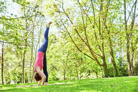 Side View Of Woman Doing Handstand Stock Photo Dissolve