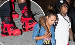 Christina Milian And Lil Wayne Are A Cosy Pair In Matching Red Trainers