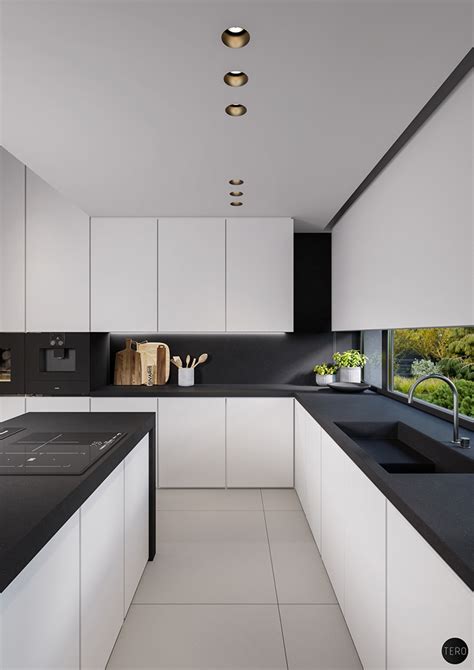 Modern white and brass light fixtures complete the look. 40 Beautiful Black & White Kitchen Designs