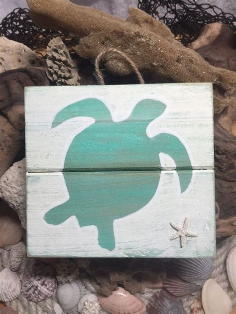 A Wooden Box With A Sea Turtle Painted On It S Side Surrounded By