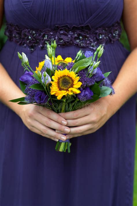 Sturdy petals, bright color, and instant charm. Bridesmaid With Sunflower Bouquet Stock Image - Image of ...