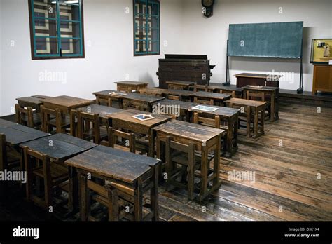 Historic Old Style Classroom With Wooden Desks At Meiji Period Stock