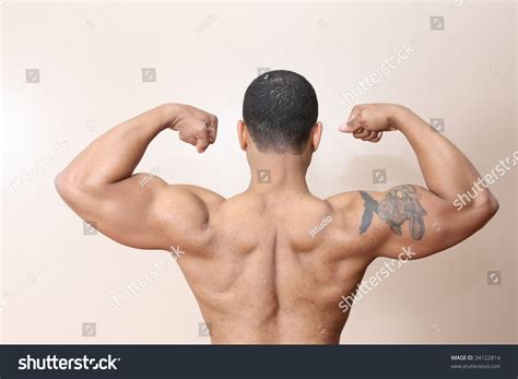 Young Male Flexing Back And Arm Muscles Stock Photo 34122814 Shutterstock