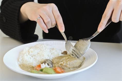A Lady Eating Curry Rice With Spoon And Fork Stock Image Image Of Hand Fork 78487957