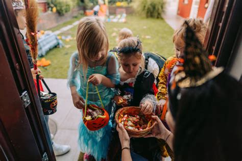 100 Woman Giving Candy To Children On Halloween Stock Photos Pictures