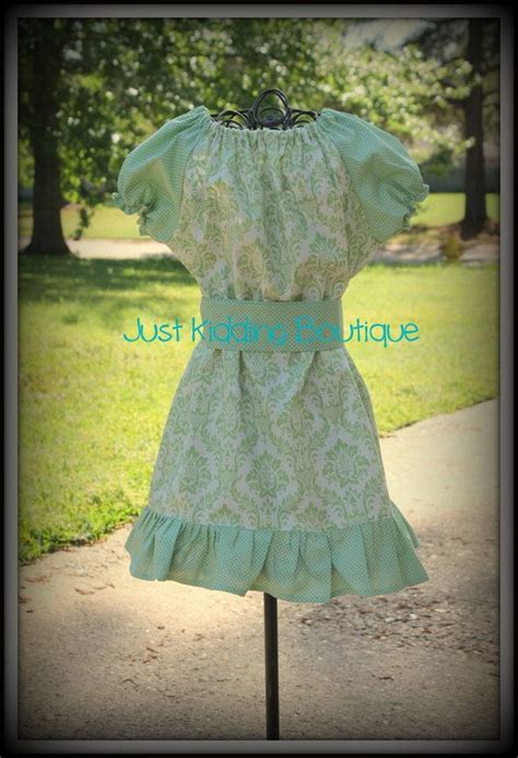 mint green damask peasant dress with mint green small polka dots on the sleeve and ruffles with