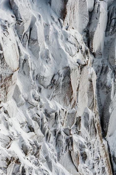 Surface Hoar Ice Crystals Formed On Rockface In Winter Stock Photo