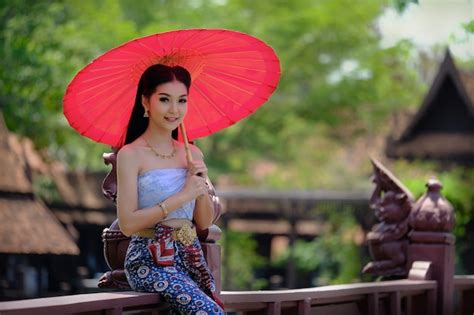 Premium Photo Beautiful Thai Girl In Traditional Dress Costume Red Umbrella