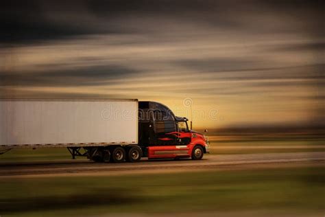 Modern Big Rig Semi Truck And Trailer In Motion On A Highway Stock