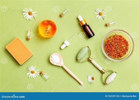 Herbal Medicine And Natural Skin Care Products On Green Background