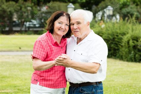 Senior Couple Holding Hands Stock Photo By ©andreypopov 126482964