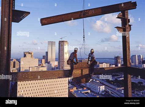 High Rise Building Under Construction Steel Workers Walking On Steel