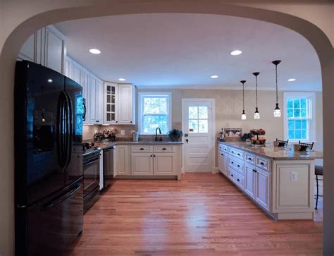 An Arched Doorway Opens To This Spacious Kitchen With A Wood Plank