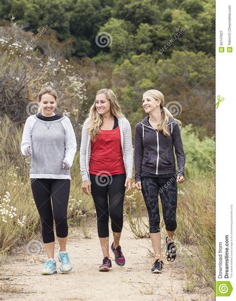 Three Women Walking And Working Out Together Stock Image