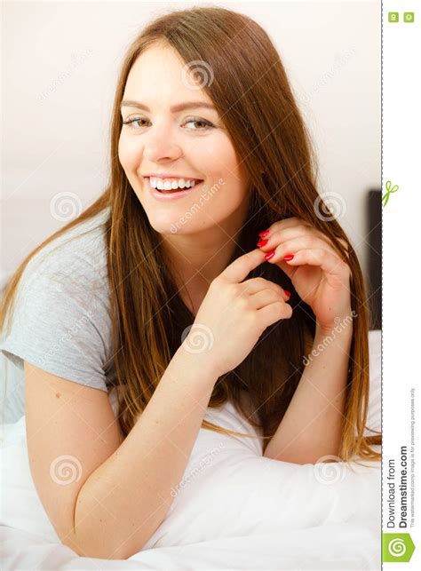 cheerful girl rolling in bed stock image image of rest sleeping 79619075