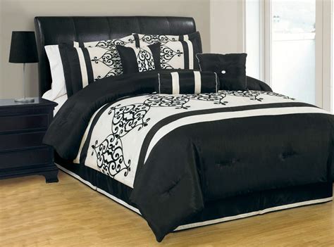 Coordinating shams match the comforter's color scheme. Queen Catherine Flocking Black and Ivory Comforter Set ...