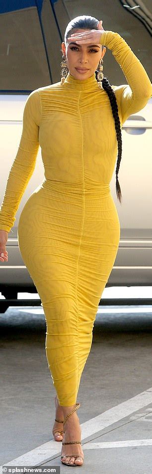 Kim Kardashian Puts Her Curves On Display In Very Tight Yellow Dress Daily Mail Online