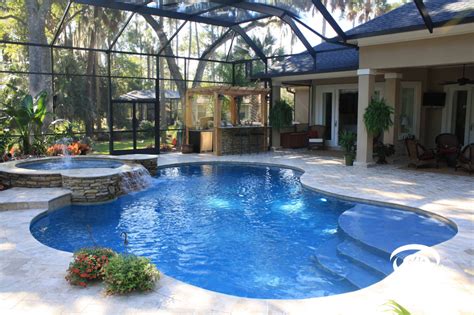 A Backyard With A Pool And Hot Tub