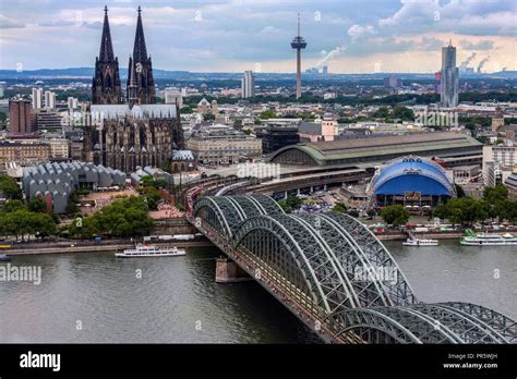 The Hohenzollern Bridge And Cologne Cathedral In The Industrial And