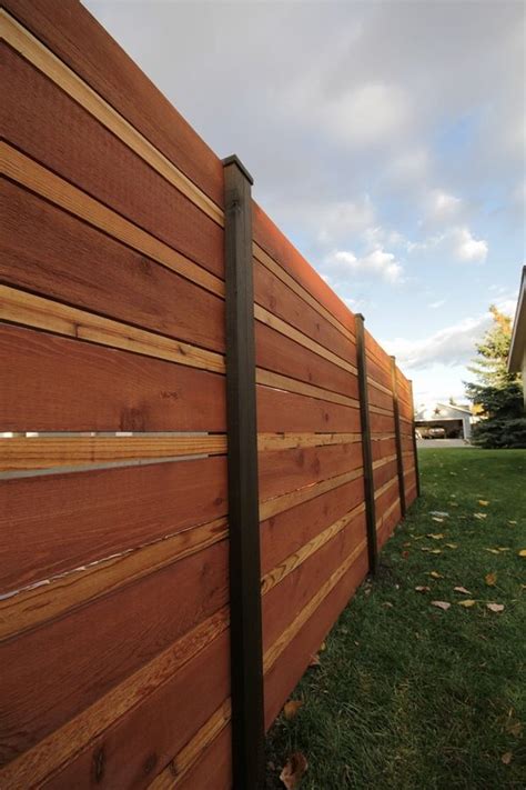 Bamboo rolls can be easily installed into wood fence posts with wood screws. Horizontal fence panels - modern garden fence design ideas