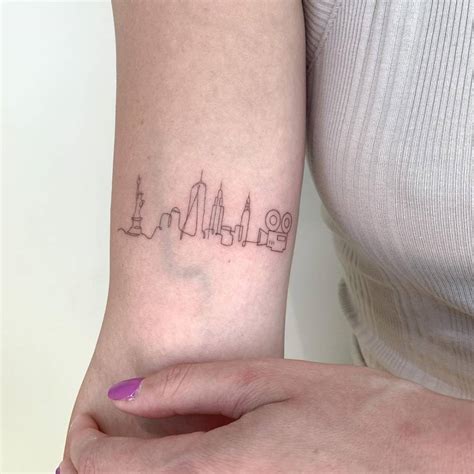 Fine Line New York City Skyline Tattoo On The Bicep