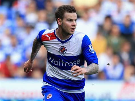 Danny guthrie attempts a tackle in his club's round three match against arsenal. Danny Guthrie to miss crunch match for Reading against QPR | The Independent