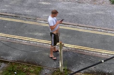 Bloke Caught Having A Hands Free Wee On Street While Using His Phone
