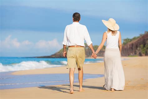 Romantic Couple Holding Hands On A Beach Stock Image Image Of