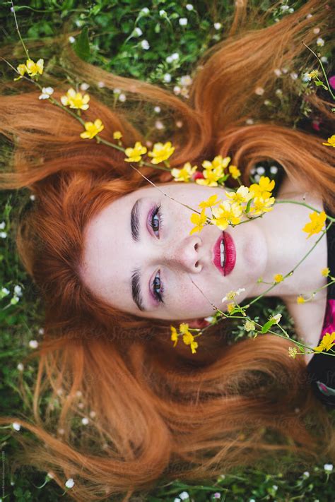 Beautiful Ginger Woman Laying On Grass By Stocksy Contributor Jovana Rikalo Stocksy