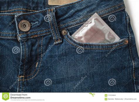 condoms in package in jeans safe sex concept healthcare medicine contraception and birth