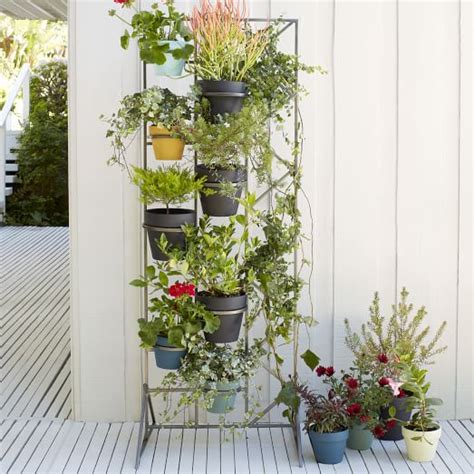 Obscuring the fence or border with the screening plants used for this application needs to be one with slow growing non invasive roots. Deco Screen Plant Stand | west elm