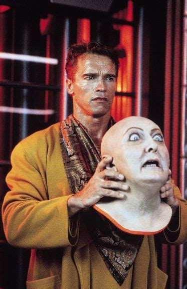 Arnold Schwarzenegger And A Robotic Mask In 1990s Total Recall