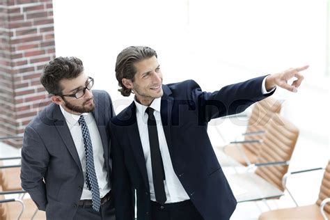 Business Partners Standing In The Office Stock Image Colourbox