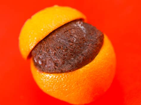 We want to cut right down through the middle. How to Bake a Cake Inside a Hollowed Orange over a Campfire