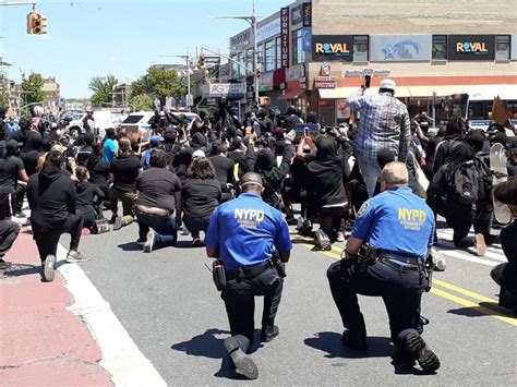 A Sign Of Hope Nypd Officers Kneel With Protesters During Queens Rally