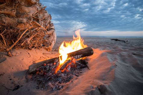 Free Download Hd Wallpaper Bonfire Near Sea At Golden Hour Campfire